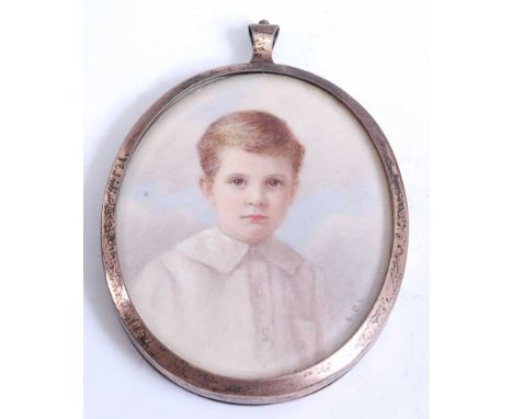 An early 20th century double-sided miniature locket in silver frame, watercolour on ivory head and shoulders portrait of a yo