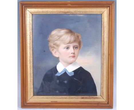A circa 1880 KPM Berlin porcelain portrait plaque, finely painted with a head and shoulders portrait of a young boy looking l