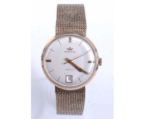 A Marvin Agenda gent's 9ct yellow gold manual wind wristwatch, having a champagne baton dial, sweeping second hand and date a