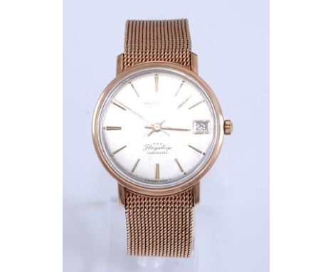 A gent's 9ct yellow gold Longines Flagship automatic wristwatch, having round silvered baton dial, sweep second hand and date