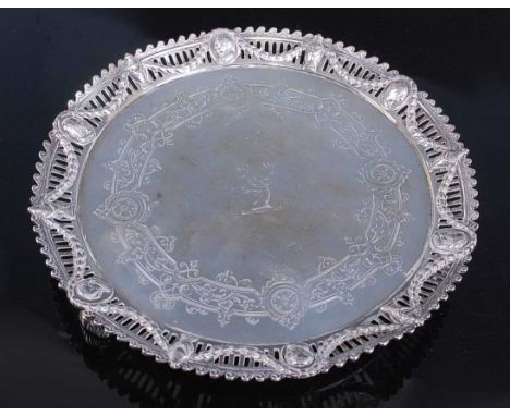 A Victorian silver circular salver,  having raised pierced and repousee crested border decorated with alternating portrait ca