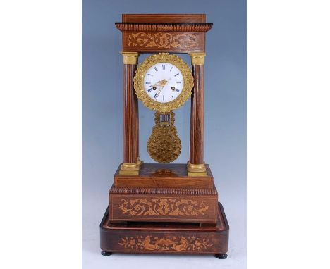 A late 19th century French rosewood and marquetry inlaid portico clock, having an unsigned white enamel Roman dial within a c