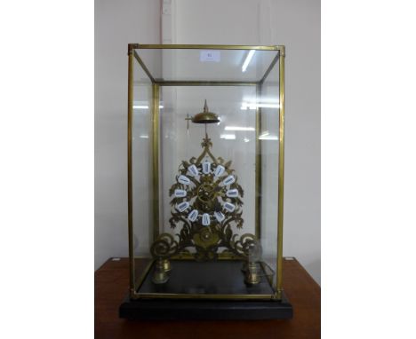 A brass fusee skeleton clock, cased