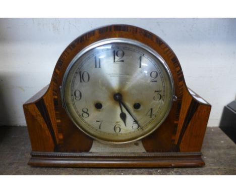 A Art Deco inlaid walnut mantel clock, with plaque inscribed; Pleasance &amp; Harper, Shrewsbury 1936, Post Office