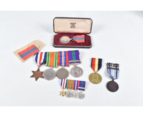 AN OFFICERS WWII AND GENERAL SERVICE MEDAL GROUP, life saving medal, Imperial service medal and a 1994 frontline Britain meda