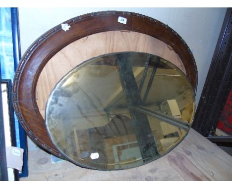 An Early 20th Century Oak Framed Wall Mirror.