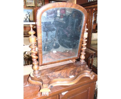 A Victorian Mahogany Dressing Table Mirror with barley twist side supports and serpentine fronted.