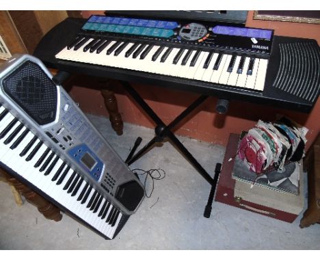 Two Piano Keyboards, (Casio & Yamaha), one with stand, and a BSR Record Player with a Selection of LP's (Josef Locke, Sound o