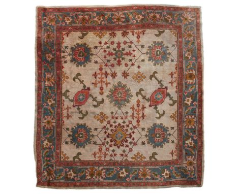 ATTRIBUTED TO ALEXANDER MORTON CO.  ARTS &amp; CRAFTS DONEGAL CARPET, CIRCA 1900   with Ushak design, the cream field with ro