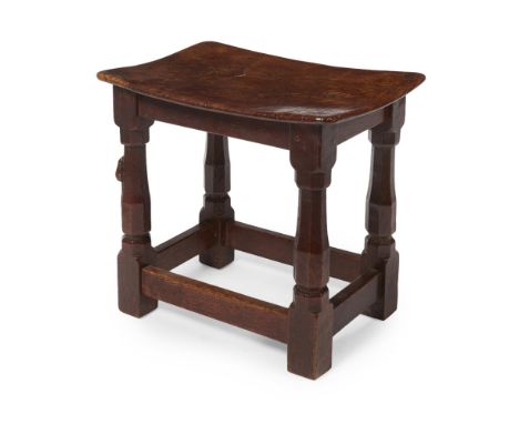 ROBERT 'MOUSEMAN' THOMPSON (1876-1955)  EARLY BURR OAK DISHED TOP STOOL, CIRCA 1930   the rectangular concave seat on facette