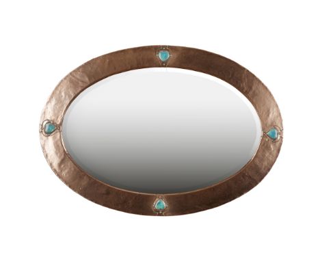 LIBERTY &amp; CO., LONDON  ARTS &amp; CRAFTS PATINATED COPPER WALL MIRROR, CIRCA 1900   of oval outline, set with heart-shape