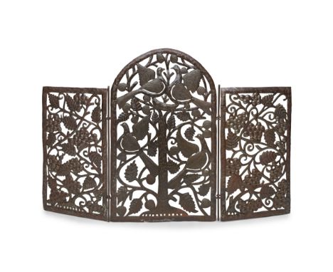 FOLK ART  STEEL FIRESCREEN, EARLY 20TH CENTURY   the three-fold screen with hinged side panels pierced and repoussé-decorated