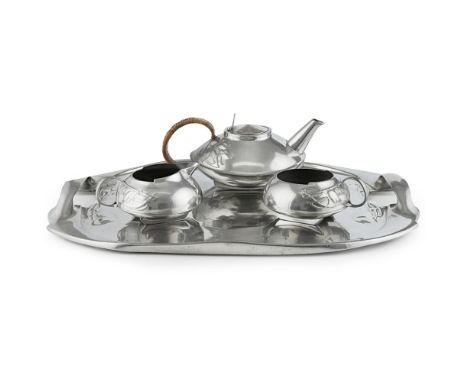 ARCHIBALD KNOX (1864-1933) FOR LIBERTY &amp; CO., LONDON  'TUDRIC' THREE PIECE PEWTER TEA SERVICE &amp; TRAY, CIRCA 1900   co