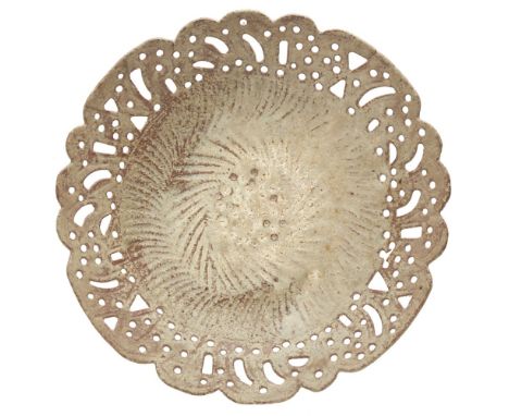[§] IAN GODFREY (1942-1992)  STONEWARE SHALLOW BOWL   with a pierced rim and ribbed well, raised on a short foot, covered in 