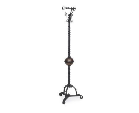 ENGLISH SCHOOL  ARTS &amp; CRAFTS WROUGHT IRON AND COPPER EXTENDING STANDARD LAMP, CIRCA 1910   with openwork reservoir holde