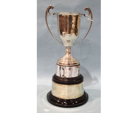 A silver trophy cup, the handles terminating with heads of dogs, London 1935, with inscription, 17cm high, (on plinth), ___6o