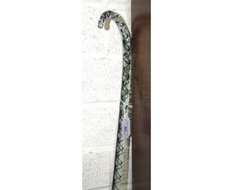 A clear glass walking stick with spiral decoration, 70cm, a collection of various 19th century drabware jugs with moulded dec