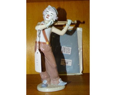 A Lladro Utopia 'Bohemian Melodies' figure of a violinist with bow, 20cm high, (in original box). 