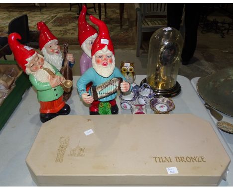 A collection of four painted ceramic gnomes playing musical instruments, 42cm high, a Kundo 400-day clock under glass dome, v