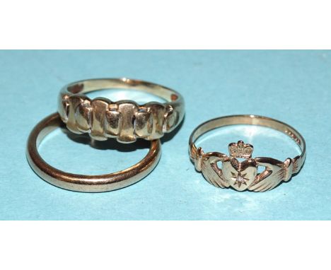 A 9ct gold claddagh ring set diamond point, size M, a 9ct gold wedding band, size N and another 9ct gold ring, size O, 5.5g, 