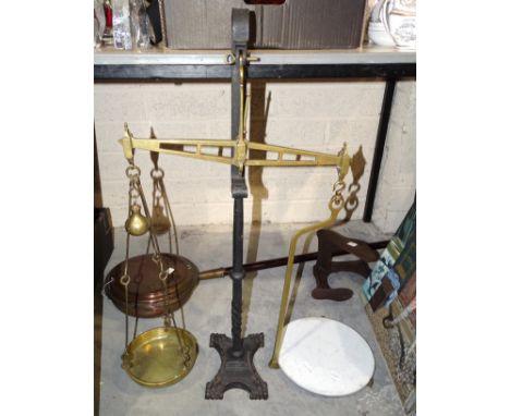 A large brass and iron scale to weigh 7lbs, with brass weight, pan and ceramic tray. 