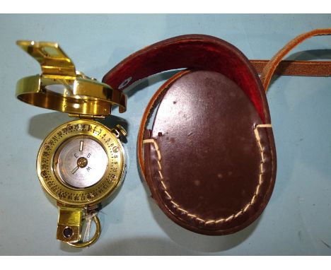 A modern brass prismatic compass by F Barker &amp; Son Ltd, Edenbridge, Kent, 9 x 6cm, folded in leather case. 
