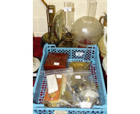 A small glass oil lamp fitted with a reflector, a brass oil lamp column and base, an opaque glass shade and chimney, a small 