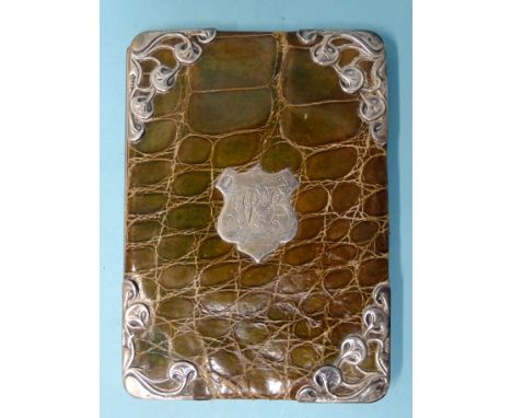 An Art Nouveau silver-mounted green crocodile skin wallet, Birmingham 1900, 14 x 10cm. 