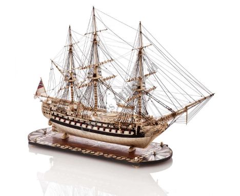 A FINELY RIGGED CARVED BONE AND HORN PRISONER-OF-WAR STYLE MODEL OF THE 74-GUN SHIP SCEPTRE, the planked and pinned hull with