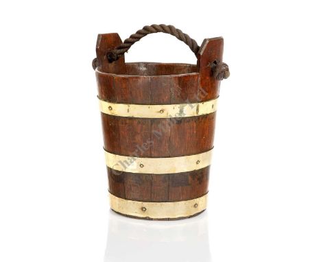 AN 18TH/19TH CENTURY OAK AND BRASS SHIP'S BUCKET, coopered with brass retaining rings and ropework handle, stamped with broad