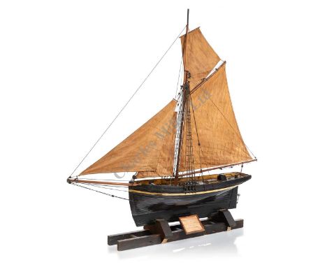 A ½IN:1FT SCALE SAILING MODEL OF A BARKING SMACK OF CIRCA 1830, PROBABLY LATE 19TH-CENTURY, the hull carved from the solid wi