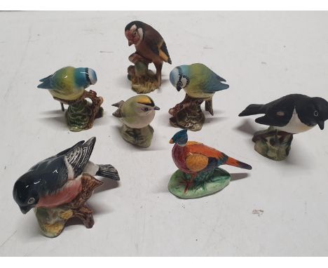 Seven Beswick ceramic bird figures, shipping unavailable