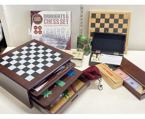 A large selection of assorted board games including chess and draughts etc