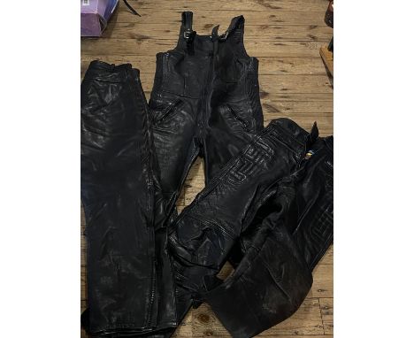 Three pairs of leather motorbike trousers (assorted sizes)