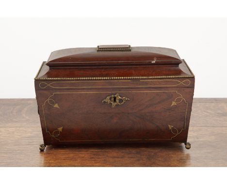 Georgian sarcophagus tea caddy rosewood, with stylised brass inlay, standing on ball and claw brass feet, with fitted interio