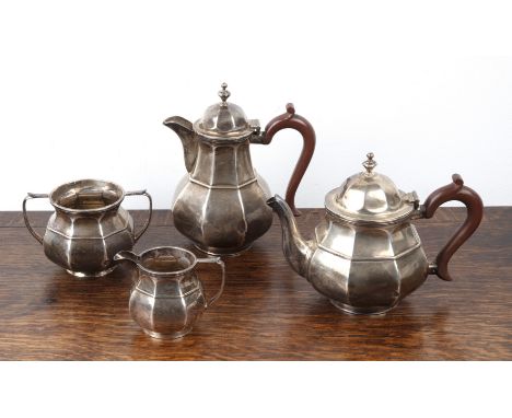 Art Deco silver four piece tea set comprising of a teapot and water pot, both with wooden handles, a twin handled sucrier and