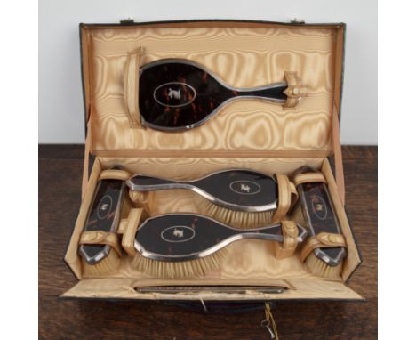 Cased silver and tortoiseshell vanity set in fitted purple leather case, the silver mounts bearing marks for William Comyns &