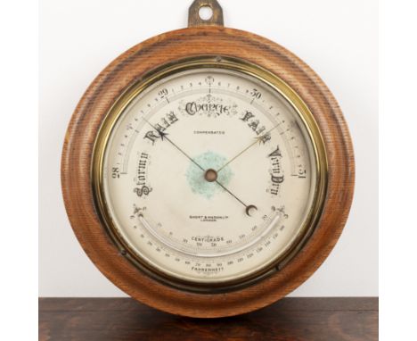 Aneroid barometerby Short & Mason Ltd. London, 7.5" silvered dial, curved mercury tube thermometer and moulded oak case, 11" 