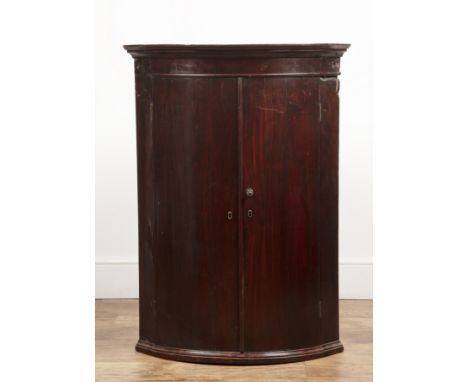 Mahogany bow front corner cupboardGeorge III, with original fitted shelves, 75cm wide x 103cm high  In original condition. Wi