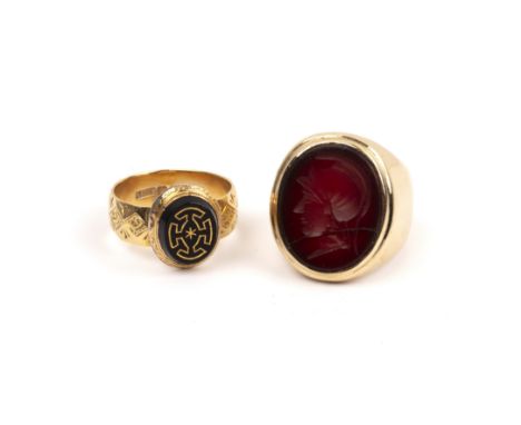 Two gold rings the first a large 9ct gold intaglio signet ring with carved centurion style figure, size R, 24g approx overall