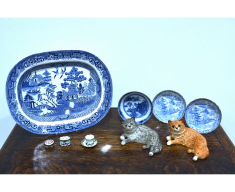 Two Beswick catsthe first cat grey, the second ginger, each dated 1876 to the base, approximately 16cm wide; together with tw