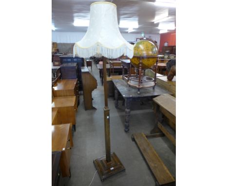 An oak and copper standard lamp 