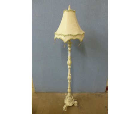 A cream painted standard lamp 