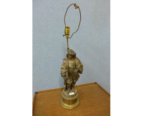 A figural table lamp 