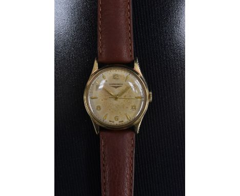 Longines - a vintage 1950s gentleman's 9ct gold cased wrist watch, textured dial, alternating Arabic numerals and block baton