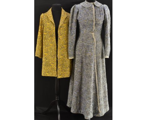 An early 20th Century Northern Indian coat, heavily embroidered overall with chain stitch abstract floral design in tones of 