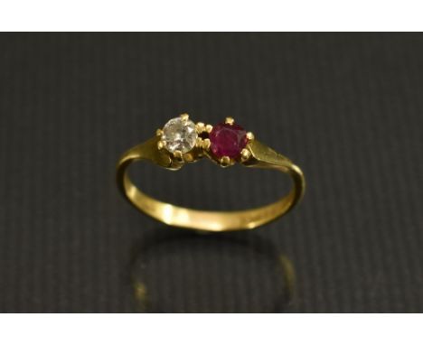 A diamond and ruby duet ring, each round cut stone approx 0.25ct,   18ct gold shank, size Q/R, London 1977, 3g gross