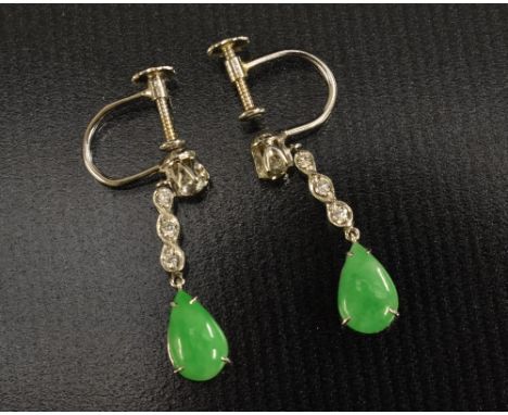 A pair of jade and diamond drop earrings, round brilliant cut diamond top, suspending a three stone diamond bar linkage above