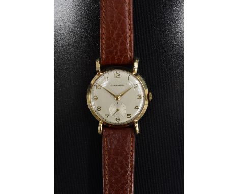 Garrard  - a vintage 1950s gentleman's wristwatch,  textured silver dial, Arabic numerals, minute track, subsidiary seconds, 