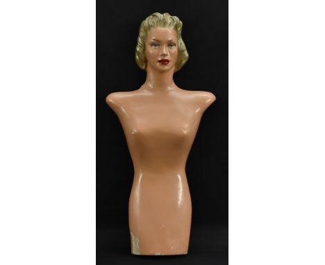 A mid 20th Century half mannequin, female, painted features and hair typical of the priod, approximately 91cm in height, widt